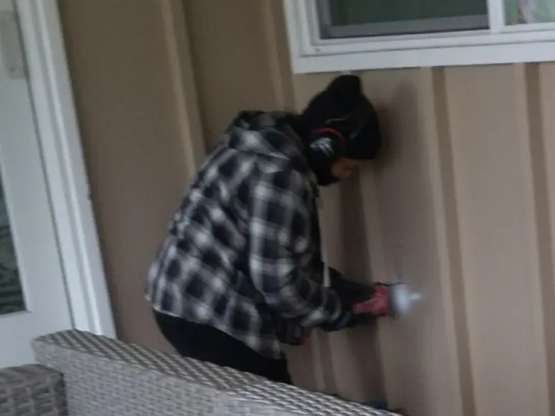 Professional electrician installing an exterior outlet in Brainerd