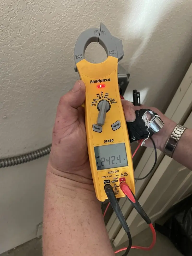 Voltage testing with clamp meter during Recessed Lighting Installation in Brainerd